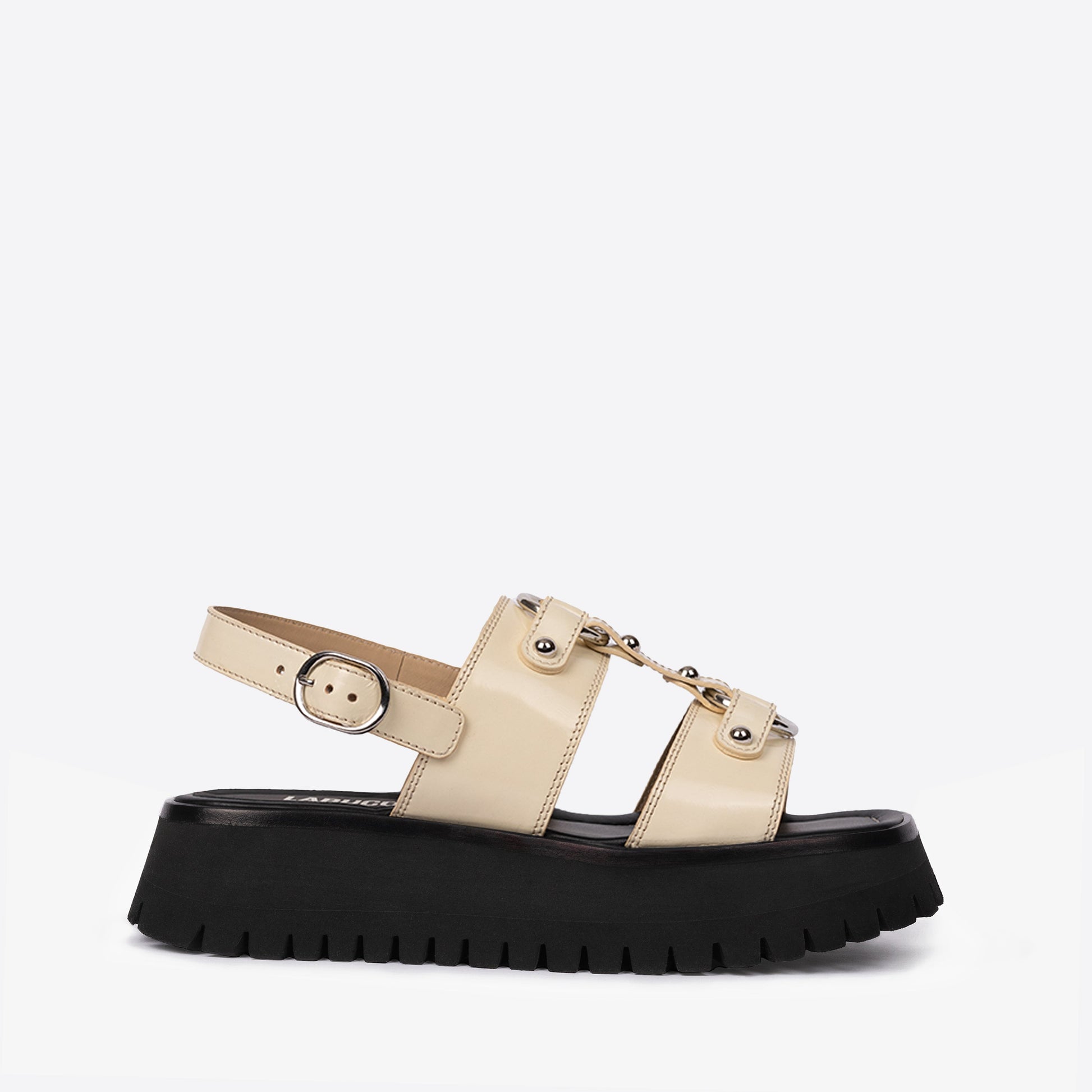 Atlas Sandal in ivory featuring leather and textile materials with a rubber sole in neutral earth tones.