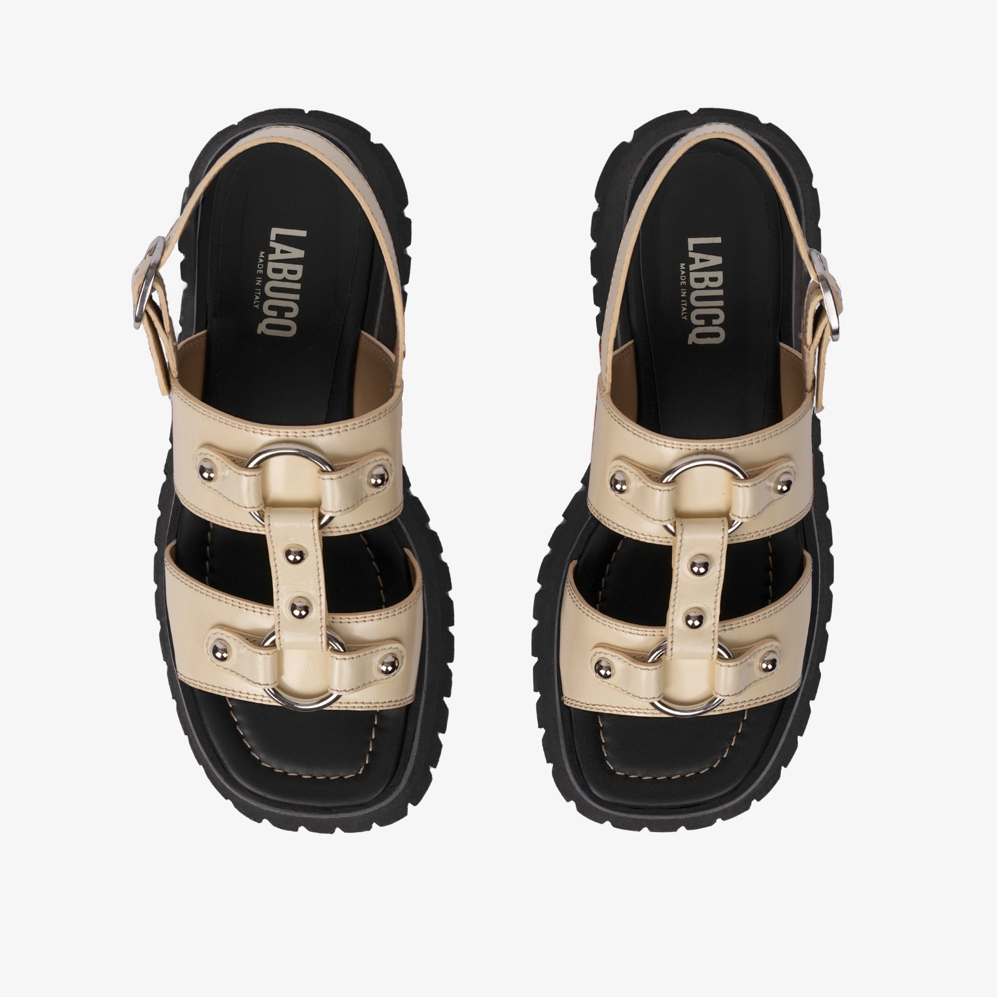 Atlas Sandal Ivory sandal displayed against product photography