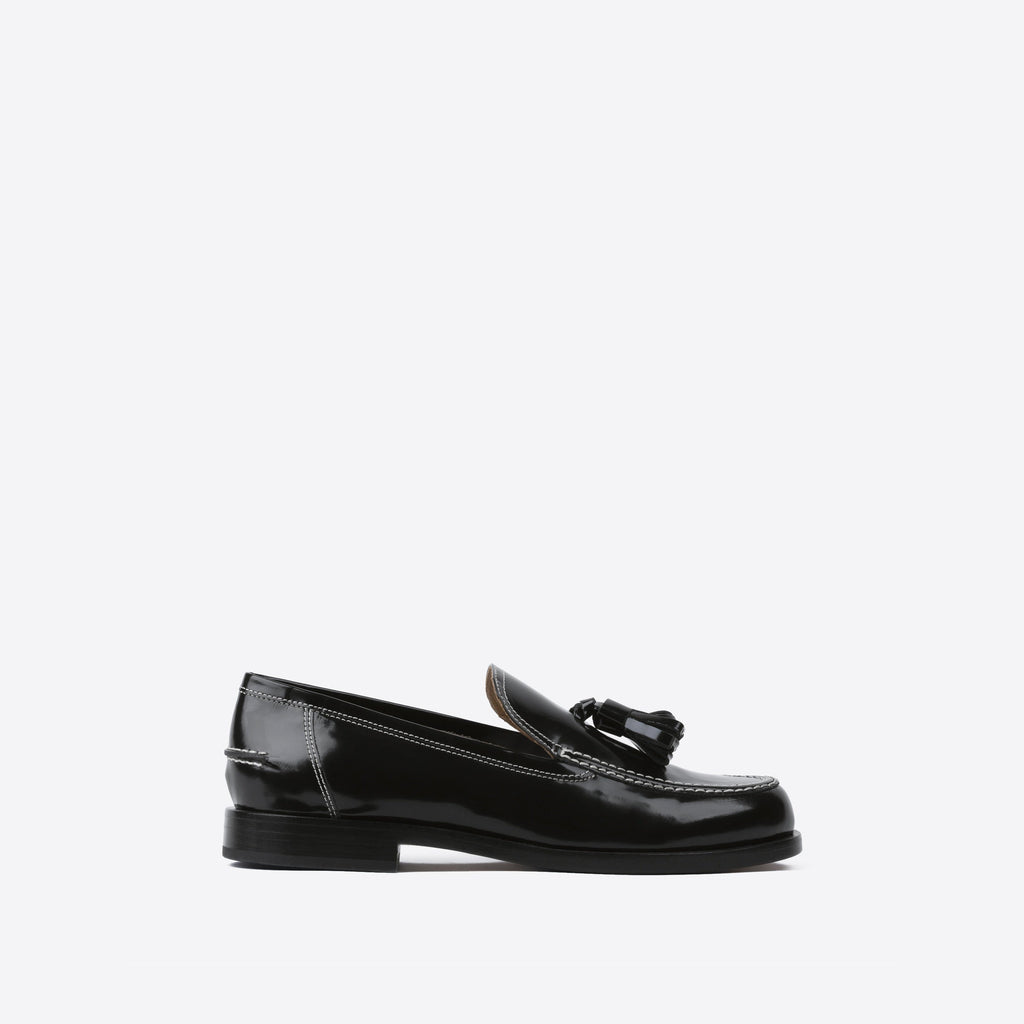 Black leather loafer on a white background