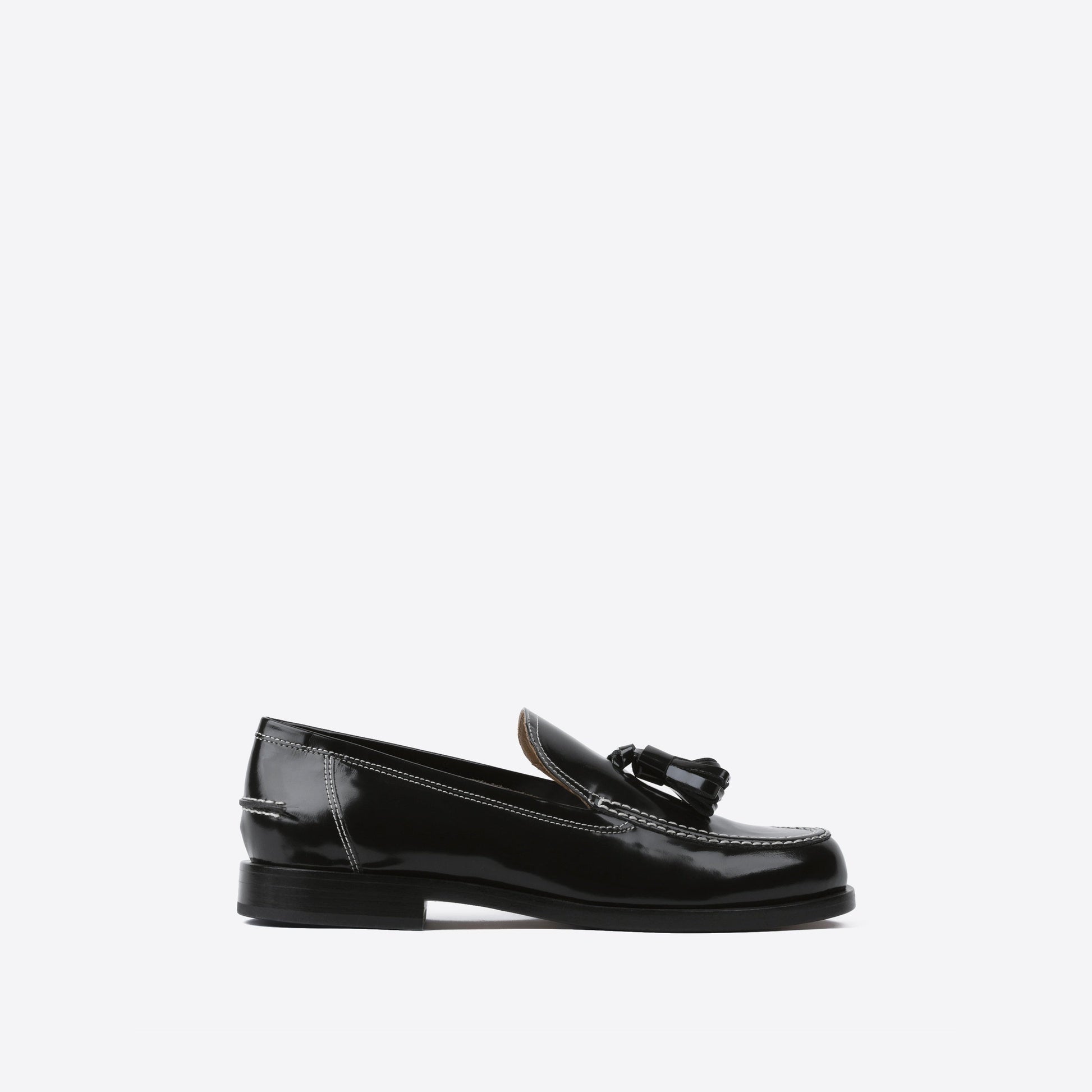 Black leather loafer on a white background