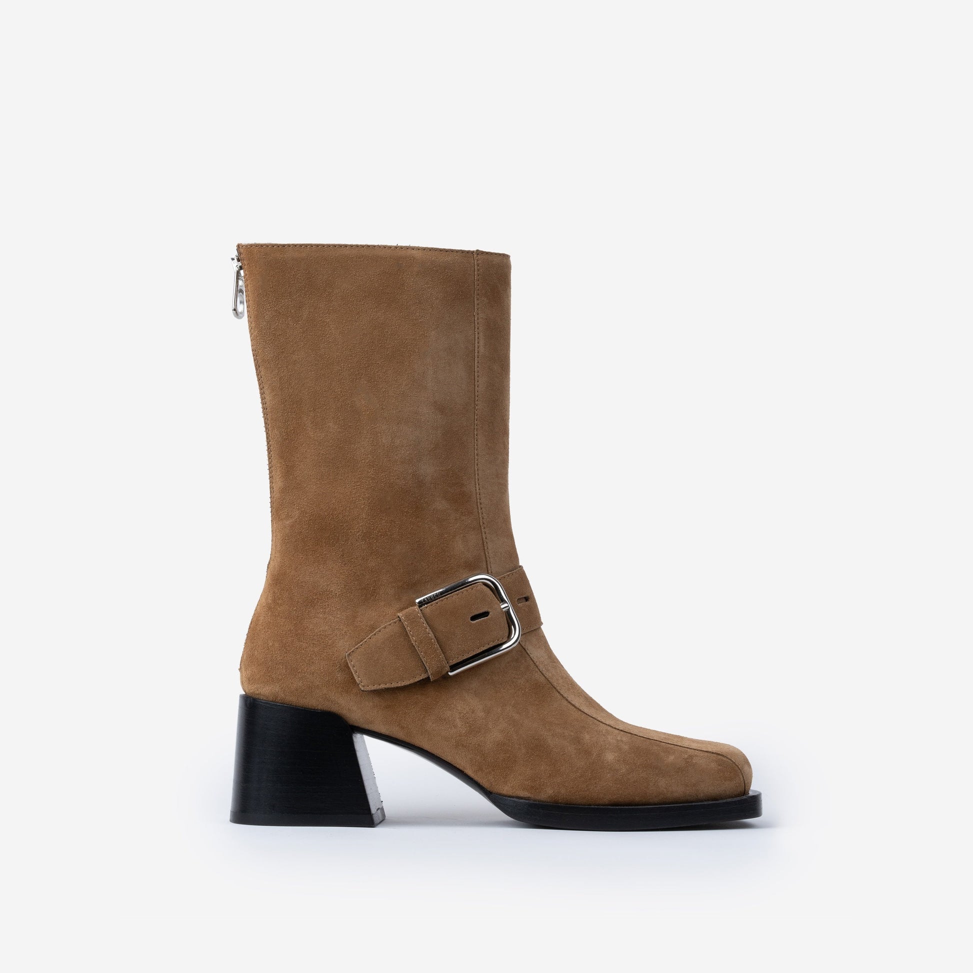Brown suede boot with a buckle on a white background