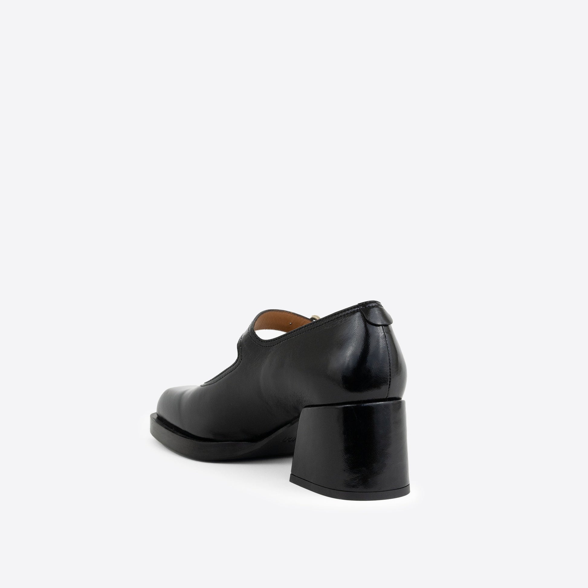 Black patent leather Maryjanes with a 2-inch heel, and a black sole on a white background