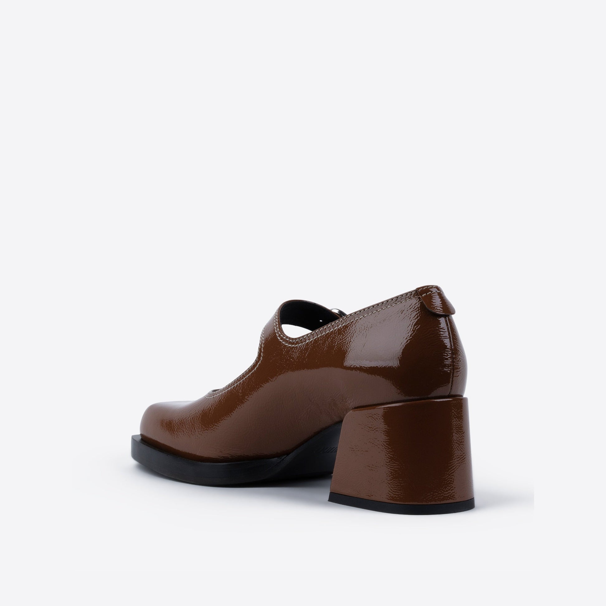 Brown patent leather shoe with a block heel on a white background