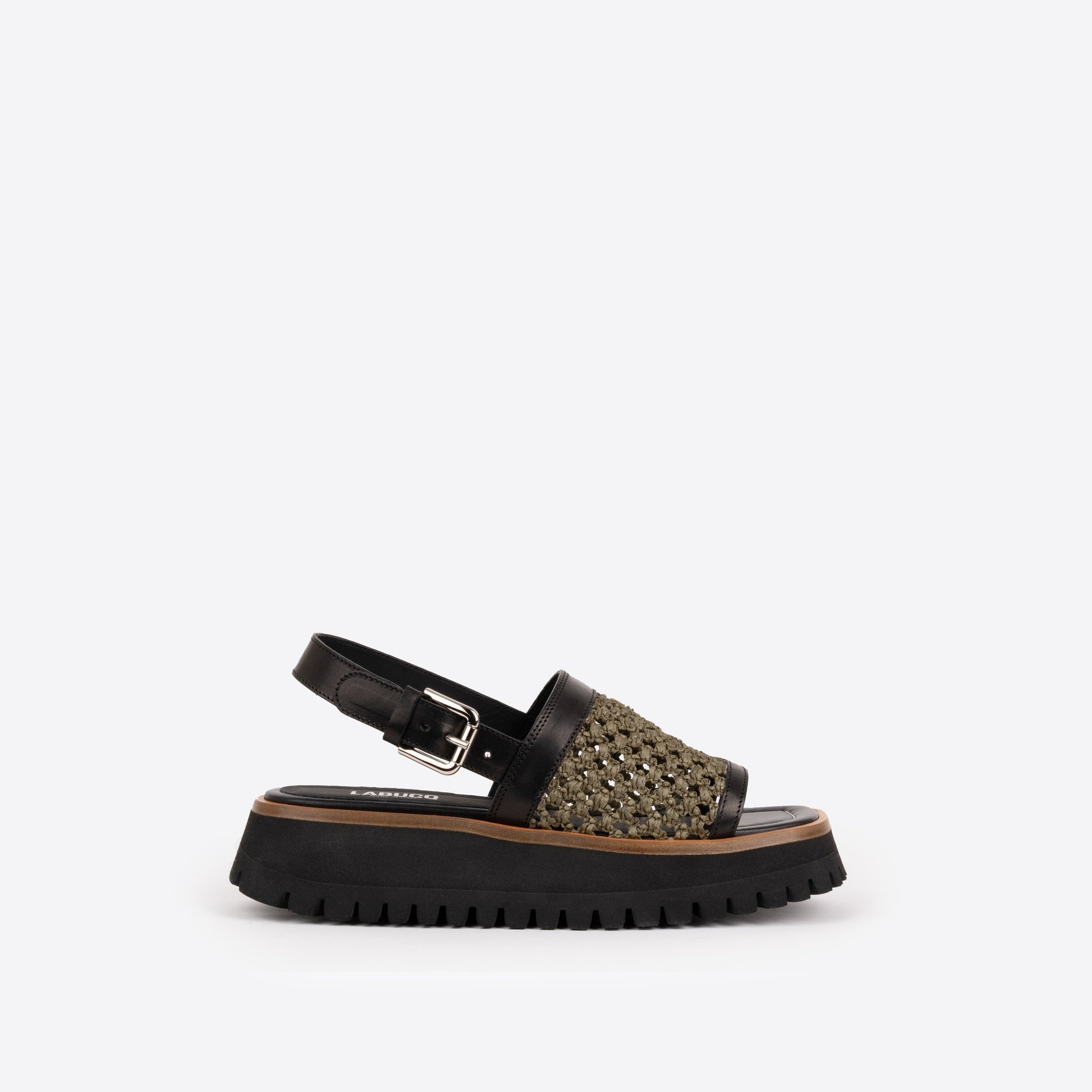 Black sandal with olive accents and a olive woven raffia strap on a white background