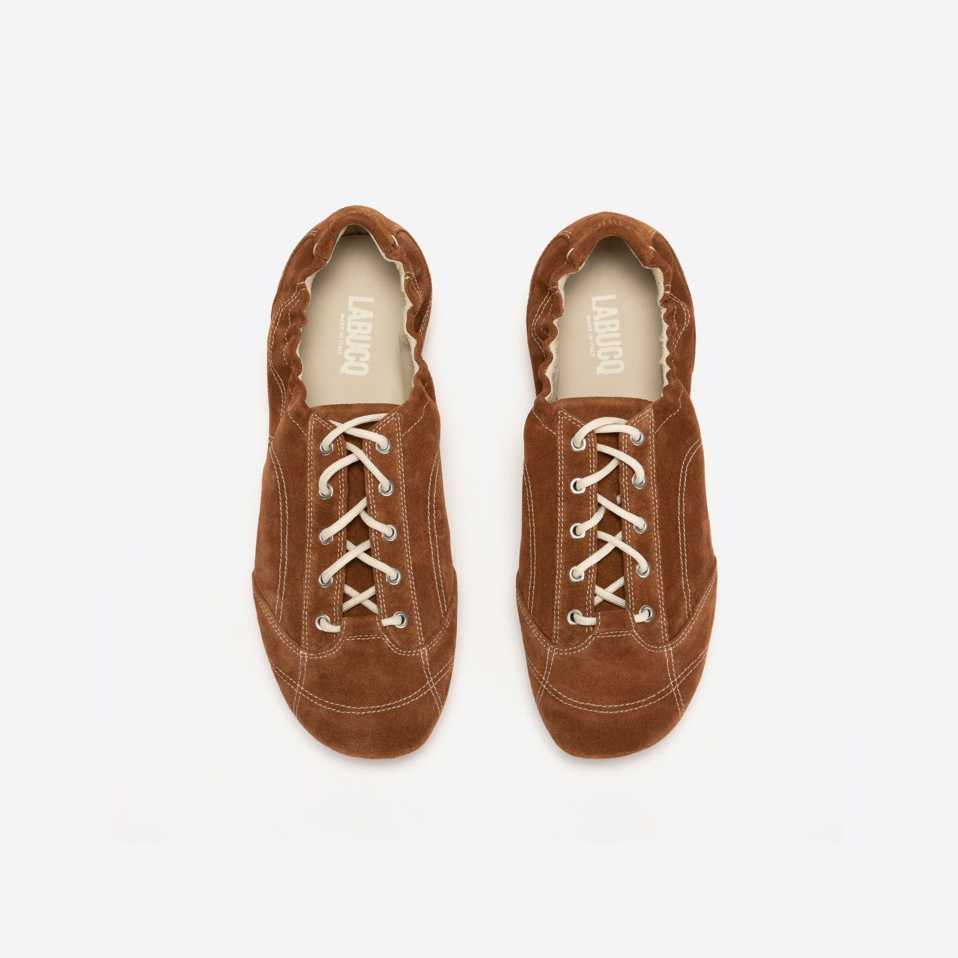 Pair of brown shoes on a white background
