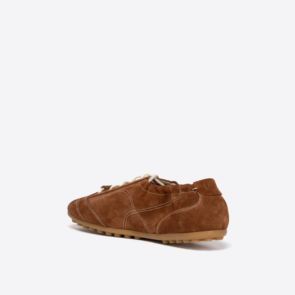 Brown suede shoe on a white background
