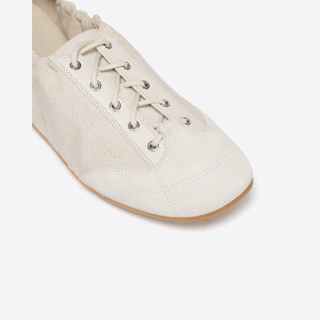 White shoe with laces on a white background