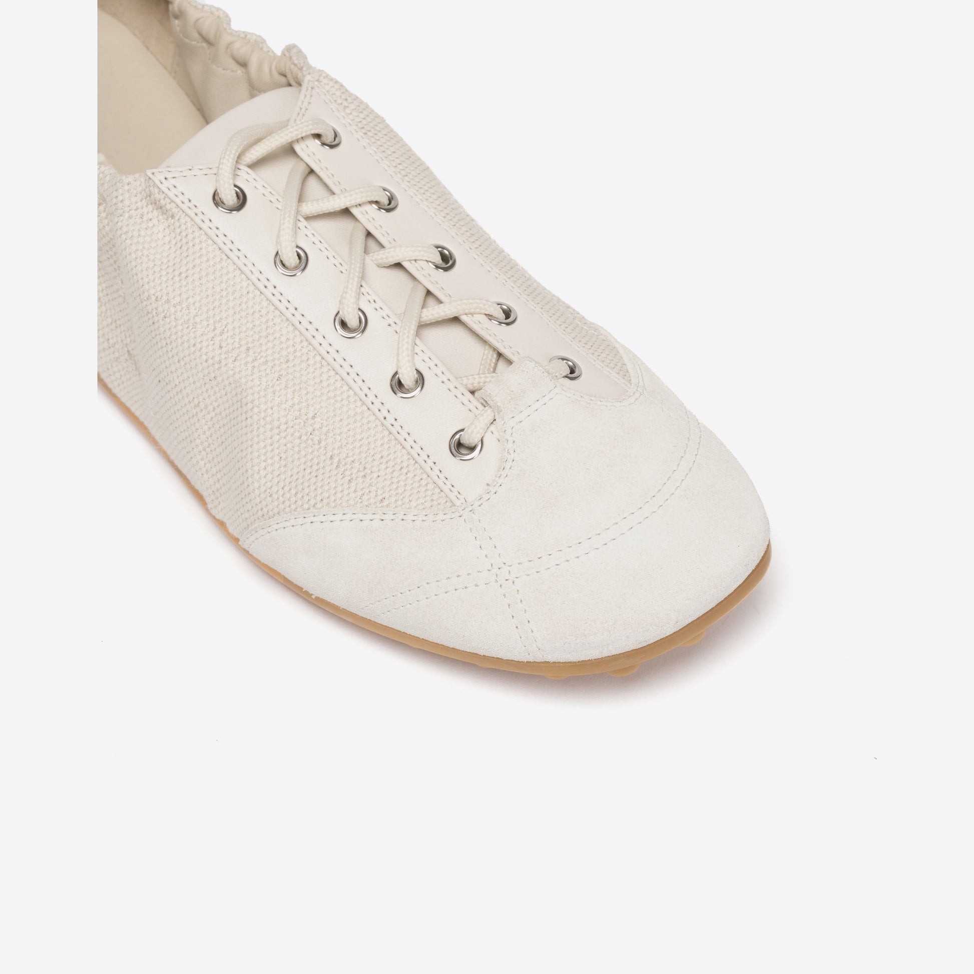 White shoe with laces on a white background