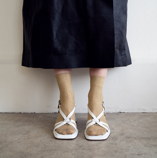 Athena Ivory in black product against studio photography