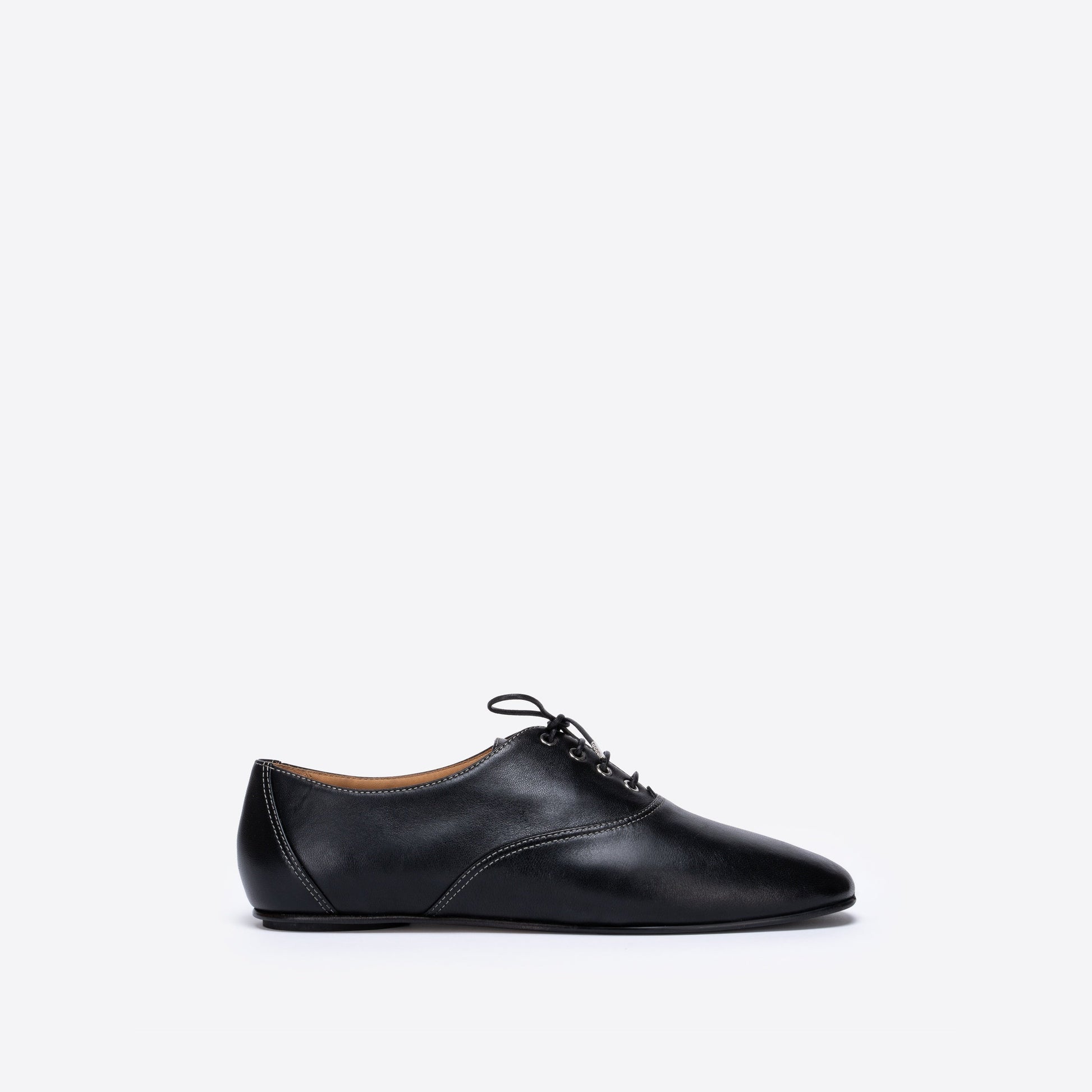 Black leather shoe on a white background
