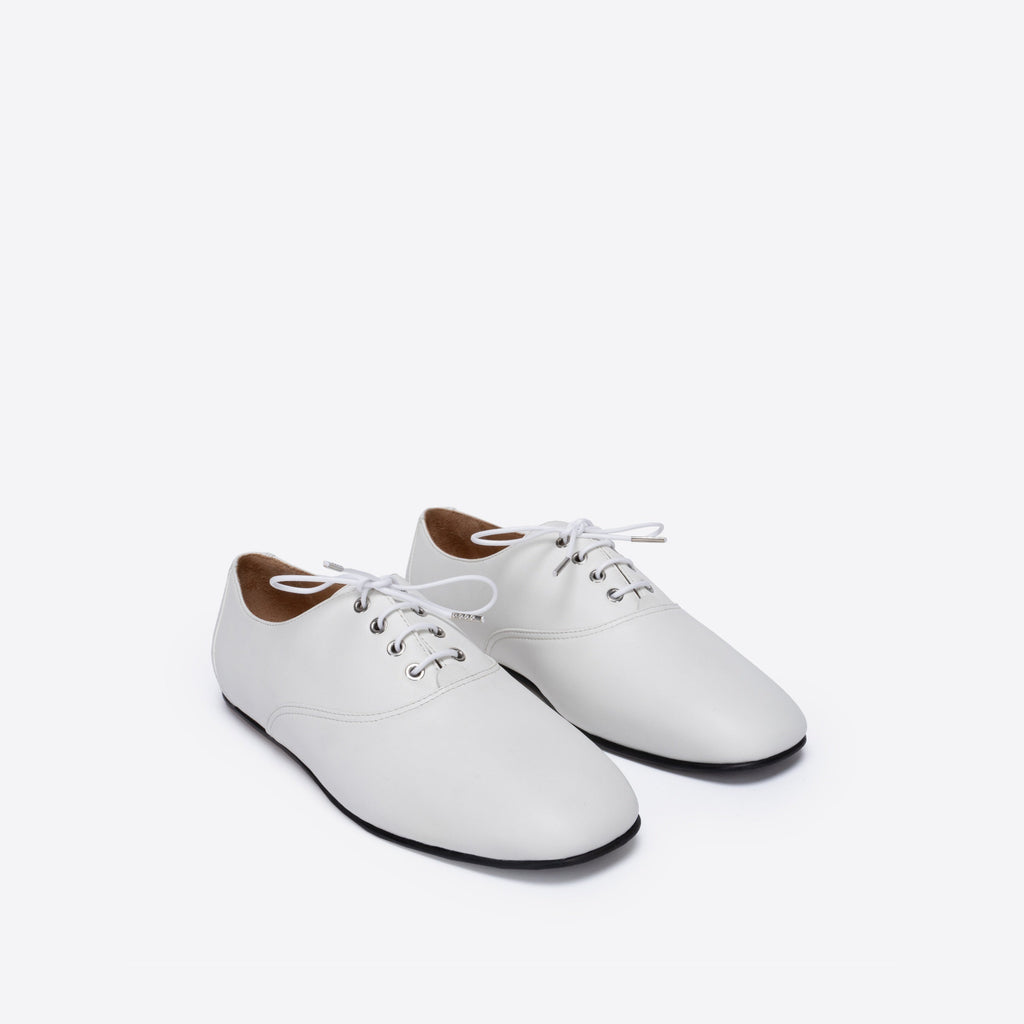 White leather shoes on a white background